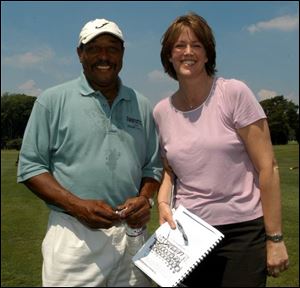 TO THE POINT: Chuck Ealey and Christine Brennan get straight to the point: the importance of the Connecting Point's golf outing at Heather Downs Country Club. The pair will be hosts for next year's event.