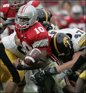 Ohio State quarterback Troy Smith fumbles in the Iowa game. The Buckeyes have lost 10 fumbles so far this season.