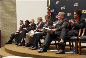 Appearing at a forum sponsored by the Toledo-Lucas County League of Women Voters and the Greater Toledo Urban League were candidates, from left, Robert Christiansen, Pamela Hicks-Hudson, Lynn Schaefer, Tim Kuhlman, Samuel J. Nugent, Daniel Pilrose, and Lourdes Santiago. The event, which attracted 25 people, took place at the University of Toledo's law school.
