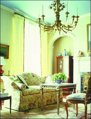 Is it old or new? This living room has period architectural details that provide a lovely background to new reproduction furniture and Aubusson-style rug inspired by 18th century France. 

