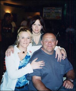 The late James Briscoe is shown with his daughter, Cheryl Kennedy, left, and his wife, Cynthia Briscoe. 