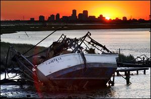 Louisiana is facing a tax loss because of hurricanes Katrina and Rita. A wrecked fishing boat dramatizes the devastation.