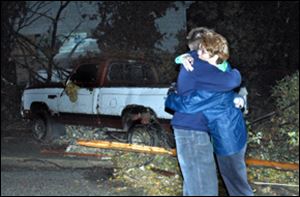 Steve Auten hugs his mother, Shelly, after a tornado swept through Newburgh, Ind., early today.
