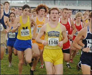 Whitmer s Skyler Schmitt keeps up with the leaders right from
the start. He placed fourth in Division I state meet.
