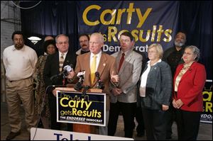 Mayor-elect Carty Finkbeiner introduces his transition team at his campaign headquarters.