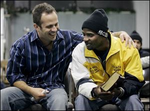 Christian singer-songwriter Eli chats with Raymond Whitley of Detroit,  a resident at the Toledo Restoration Church home, before picking up his guitar and performing. Eli s 1998 debut disc included a No. 1 hit song,  King of the Hill. 
