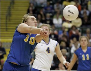 St. Ursula's Abby Walla bumps the ball toward the net against Cincinnati Seton. Walla finished with 14 digs.