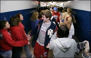Patrick Henry football player Clint Creager and teammates receive plenty of support from fellow students.
