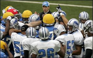 Lions interim coach Dick Jauron claps during a practice session, but he clearly has his work cut out for him.