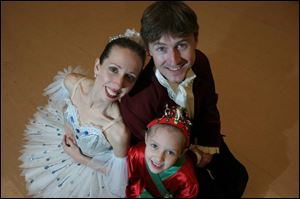 Performing in this year's production of <i>The Nutcracker</i> are Nik Zisk, his wife, Heather Iler, and their daughter, Madison, 7.