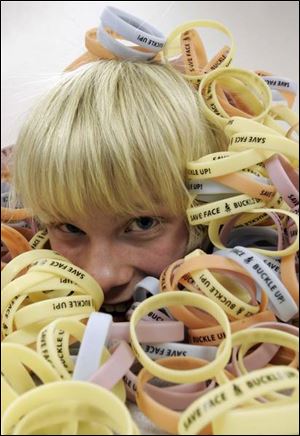 Garrett Steffan, 17, is a member of the Youth Advisory Board that came up with the 'Save Face, Buckle Up' wristband idea.