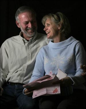 Kathie Koenigseker and her husband, Jim, hold letters from her children, who told her what they learned from her.