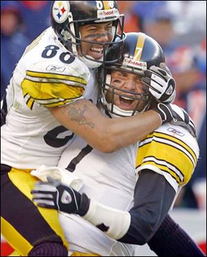 Hines Ward jumps on Ben Roethlisberger after the Steelers quarterback scored on a four-yard run in the fourth quarter.