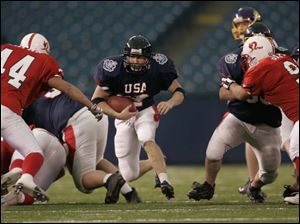 Napoleon's Brad Weaver finds a big hole in the 10th Annual Global Junior game. 