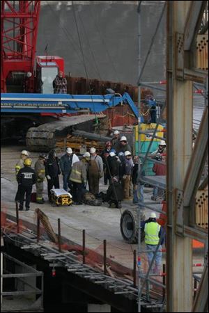 Rescuers remove an injured ironworker from the I-280 bridge construction area. 