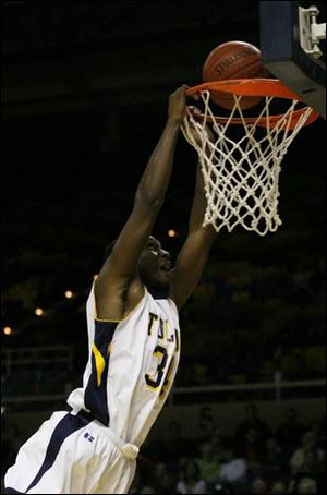 Toledo's Ridley Johnson goes airborne for a dunk against Eastern Michigan to score his only points in the game.