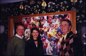 SEND IN THE CLOWNS: From left, Jim Murray, Wendy Gramza, and Bob Savage enjoy the festivities.