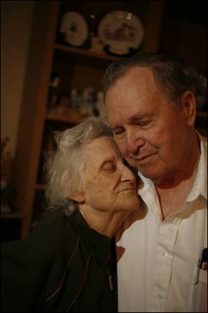 Carl and LaJean Franklin, married Feb. 14, 1945, share a moment in their Millbury home.
