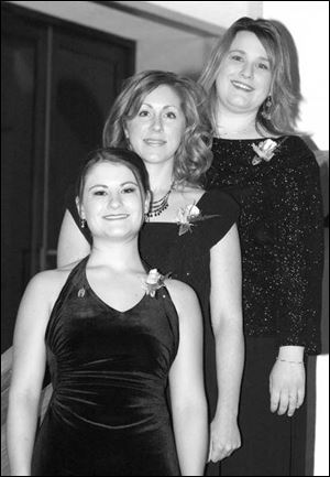MOMS' NIGHT: Emily Roman, left, Kelly Scanlon Hampton, and Beth Gongwer are all dressed up for their big night out.