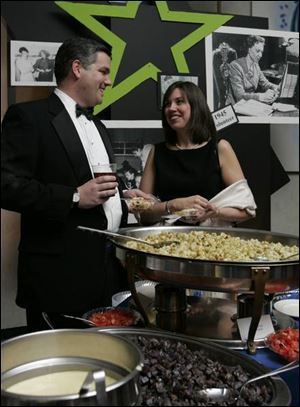 AFTER HOURS: George and Kathy Lathrop soak in the atmosphere of Toledo After Hours at the Stranahan.