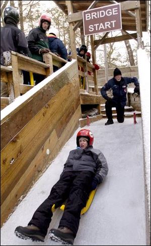 Ben Eikey, a member of Boy Scout Troop 287 in Portage, Mich., begins his first luge ride.