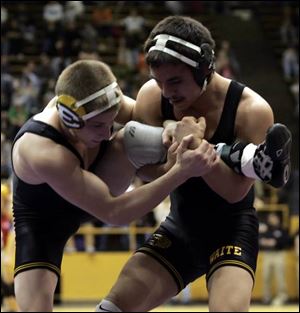 Waite s Angelo Castillo, right, never trailed during his match with Lakewood St. Edward s Shawn Harris, winning the 135-pound division with an escape with only nine seconds remaining. 