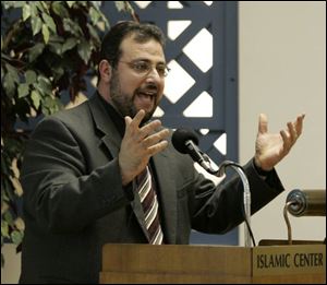 Imam Yahya Hendi addresses a crowd of about 350 people at the Islamic Center of Greater Toledo.