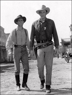 Dennis Weaver, left, as deputy Chester, stands with James Arness as Marshall Matt Dillon in  the TV western 