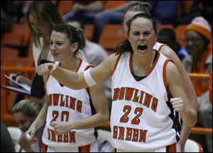 Kate Achter, left, and Ali Mann will be cheering again tonight if the Falcons can defeat Miami for an undefeated MAC season.
