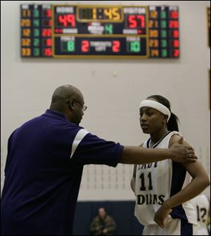 Waite coach Manny May encourages Anedria Allen not to give up with 1:45 left in the game against Amherst Steele.