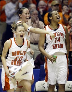 BGSU's Kate Achter, left, Ali Mann, center, and Carin Horne enjoy the final moments of their MAC championship victory.