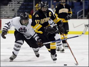 Northview outshot University School 27-13, thanks to the efforts of players like Alden Hirschfeld (17), who wouldn't let University School's Yule Baron separate him from the puck.