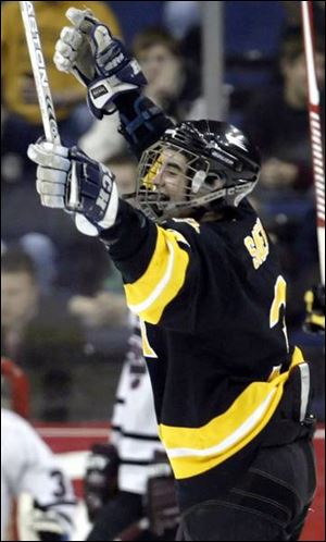 Northview's Nic Saenz (top) celebrates Zak Pizza's second-period goal. Northview outshot University School 27-13, thanks to the efforts of players like Alden Hirschfeld (17), who wouldn't let University School's Yule Baron separate him from the puck.