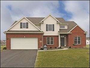 The home at 4734 Middle Branch is offered at $309,900 by Tarsha Building Company, Inc. 