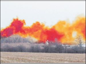 A chemical reaction at a hazardous waste facility in Vickery, Ohio, forms a toxic cloud of nitrogen dioxide. 