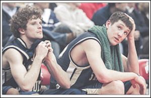 St. John's Mike Floyd, left, and Andrew Taylor watch the final seconds of the state semifinal loss. Taylor had 24 points and seven rebounds.