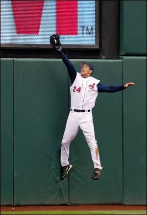 Indians center fielder Grady Sizemore robs Minnesota's Justin Morneau in the second inning.