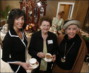 Sandra Seiple, left, Mildred Allred, and Jean Smith at the Opera Guild member tea.
