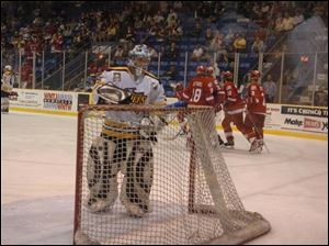 Toledo Storm players celebrate behind Johnstown goaltender Jonathan Boulin following Bracken Kearns' 
second-period goal. The Storm jumped out to a 4-0 lead before the Chiefs staged a furious third-period rally.