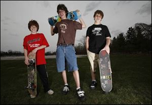 Sam Miller, 11, from left, his brother Ben Miller, 14, and Nick Hosinski, 14, hope to have a skate facility built at Veterans' Memorial Field in Sylvania.