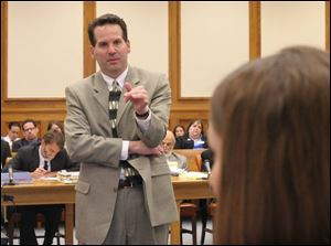 Defense attorney John Thebes questions prosecution witness Diane Gehres.