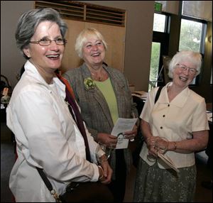 Joan Light, left, Sheri Bannister, and Jan Samples share a laugh at the W.W. Knight Nature Preserve benefit.
