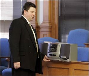 Assistant Lucas County Prosecutor Robert Miller plays a tape of a message Bob McCloskey left
for EJS Properties LLC. The ex-councilman was accused of seeking money from the developer.
