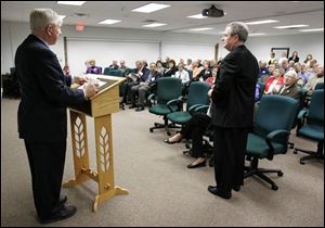 Company Chairman Dick Anderson, left, introduces President and CEO Mike Anderson to shareholders in Maumee.