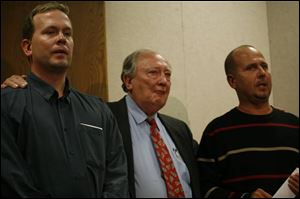 From left, Patricia Saunders' brother Michael, father Jim, and brother Jerry Staczek discuss the tragedy through their tears. 