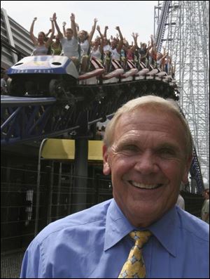 CEO Dick Kinzel said dropping some prices at Cedar Point is a response to the economy.