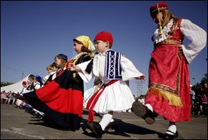 
A group of children participates in an ethnic dance at last year s Greek-American Festival at Holy Trinity Orthodox Cathedral in Toledo. The festival, slated for Sept. 8-10 this year, is a celebration of the Orthodox faith and Greek culture. 

