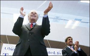 Gubernatorial candidate Ted Strickland cheers supporters during a campaign appearance yesterday at Martin Luther King, Jr., Plaza with Sen. John Kerry.