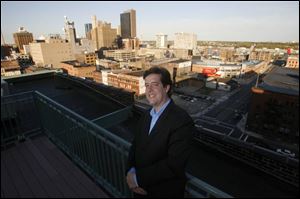 The roof of the Bartley Lofts condominiums, where Blade staff writer Christopher D. Kirkpatrick resides, features a swimming pool but also provides an impressive view of downtown Toledo s skyline.
