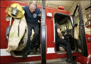 
Bob Bell, president and CEO of the Toledo Symphony Orchestra, exits Engine 17 at the city fire station at Central Avenue and Albion Street.
